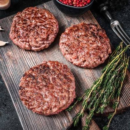 Juicy Air Fryer Hamburger Patties served on burger buns with lettuce, tomato, cheese, and pickles